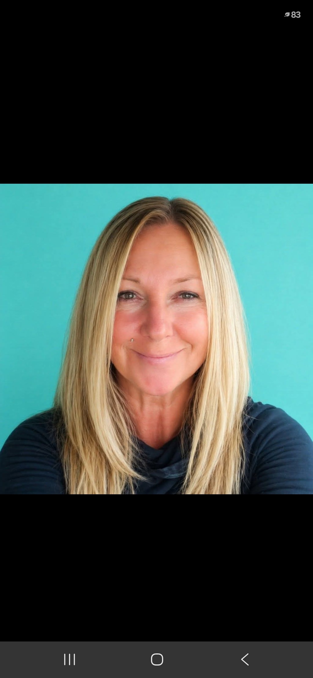 Beauty professional preparing a serene treatment space